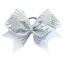 White glitter bow with big rhinestones in a heavy spray pattern